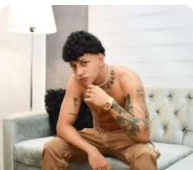 Jerkmate Male Model sitting on Sofa